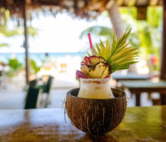 enjoying-a-refreshing-cocktail-on-a-tropical-beach-2025-03-09-13-58-37-utc